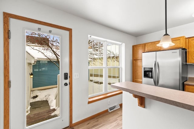 doorway to outside featuring light hardwood / wood-style floors