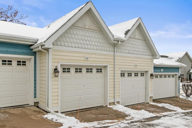 view of snow covered garage