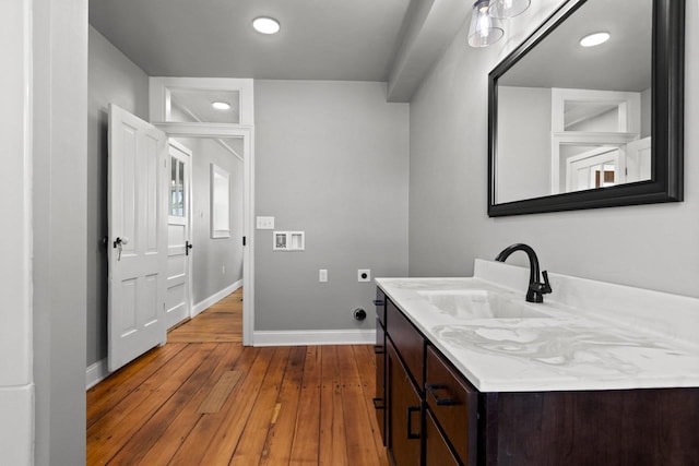 bathroom with vanity and hardwood / wood-style floors