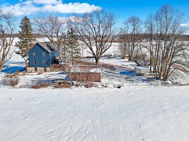 view of yard layered in snow