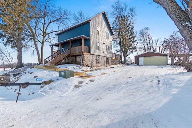 view of front of house featuring a garage and an outdoor structure