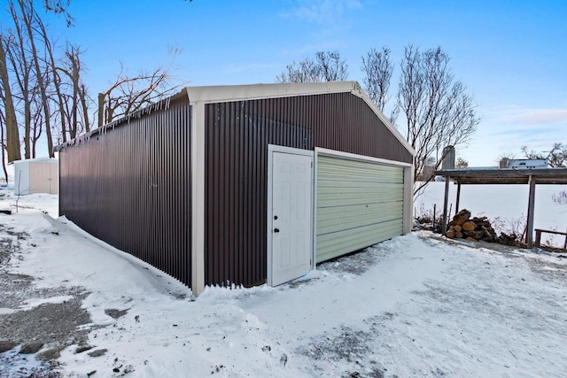 view of snow covered garage