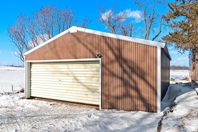 view of snow covered garage