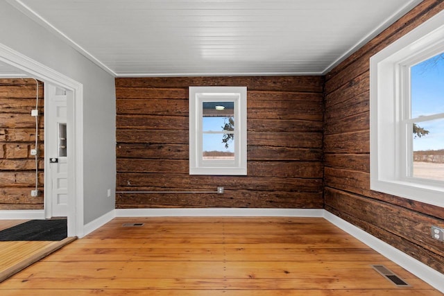 empty room with light hardwood / wood-style floors