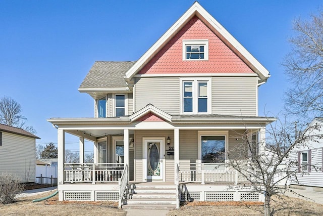 victorian house featuring a porch