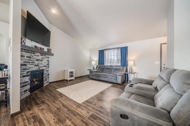 living room featuring a fireplace, dark wood-type flooring, and vaulted ceiling