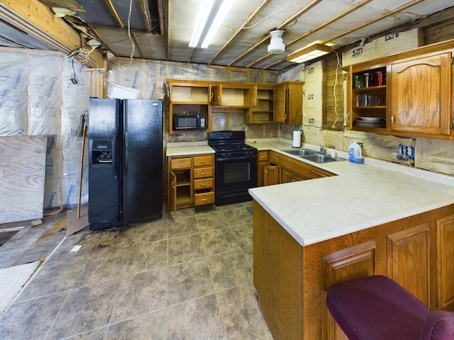 3675 Flanner Ln, Laona, WI 54541 - kitchen with kitchen peninsula, sink, and black appliances