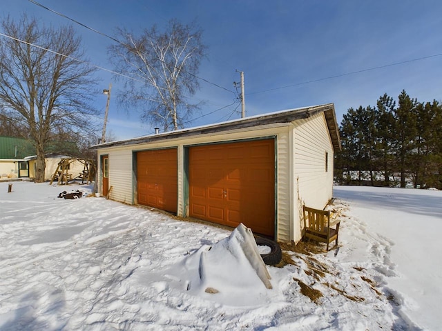 view of snow covered garage