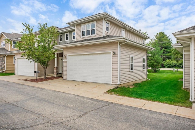 view of front of house with a garage and a front yard