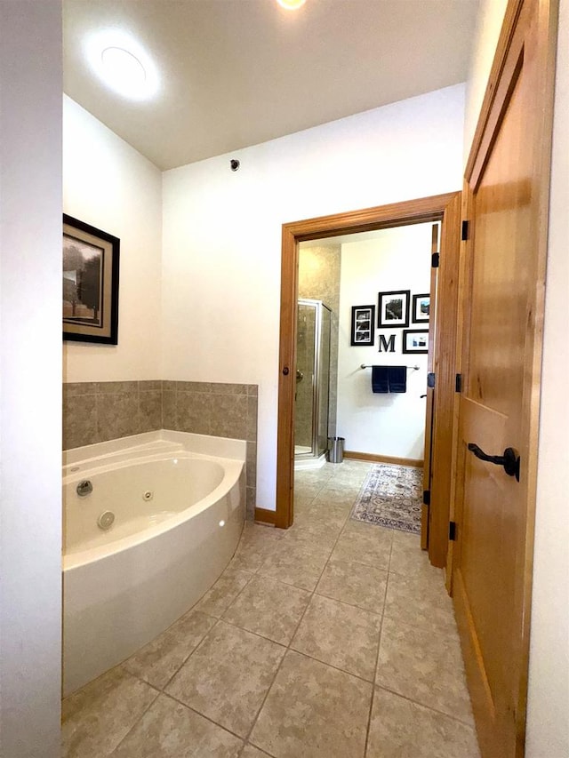 bathroom with tile patterned floors and plus walk in shower