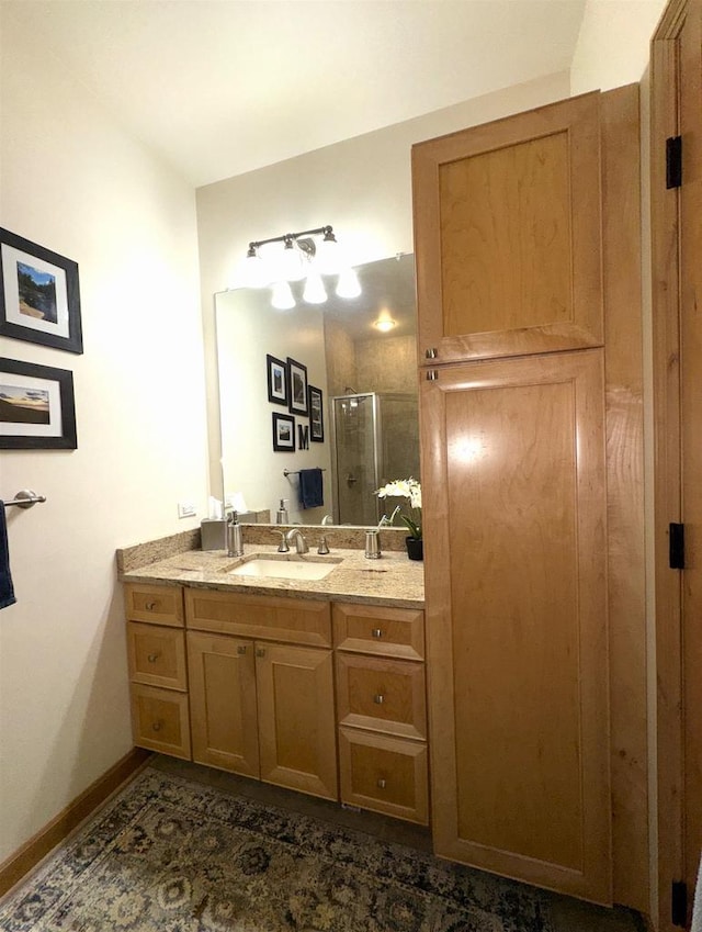 bathroom featuring vanity, tile patterned floors, and walk in shower