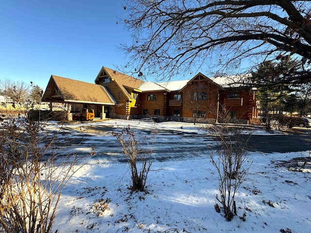 view of snow covered house