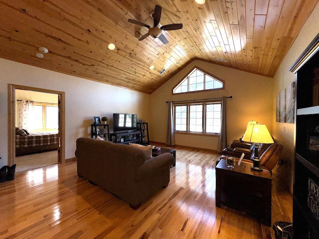 living room with wood ceiling, ceiling fan, lofted ceiling, and light wood-type flooring