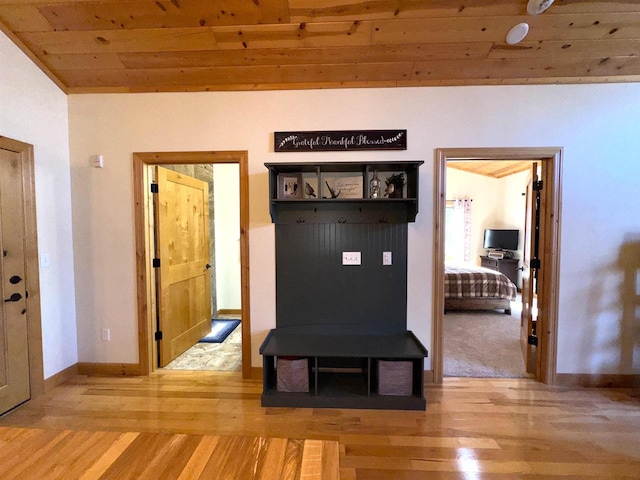 mudroom with hardwood / wood-style floors and wood ceiling