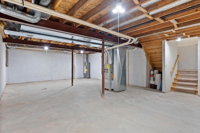 basement featuring water heater and heating unit