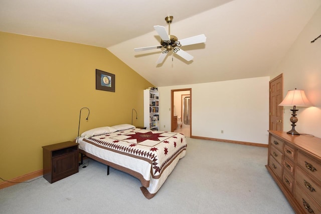 carpeted bedroom featuring lofted ceiling and ceiling fan