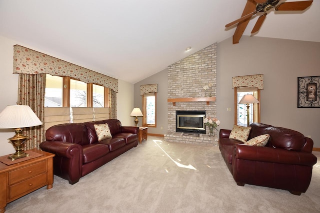 living room with ceiling fan, vaulted ceiling with beams, light colored carpet, and a fireplace