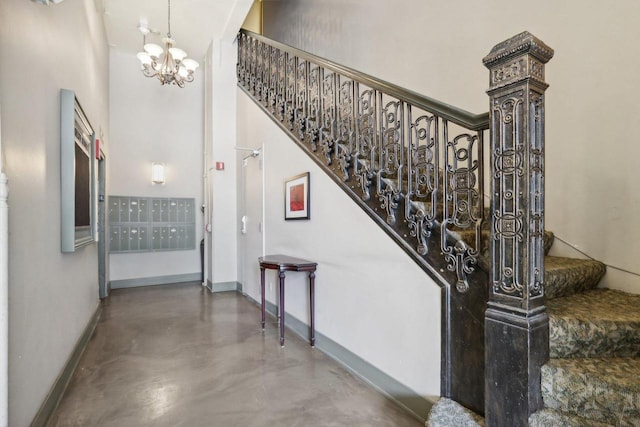 staircase with mail boxes and concrete floors