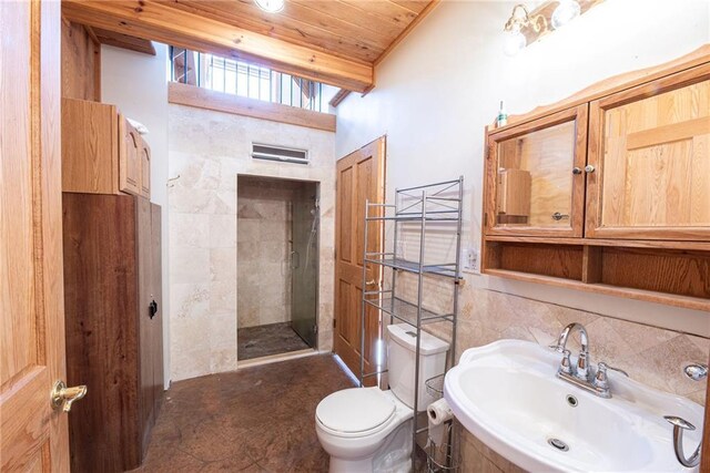 15035W Goss Rd, Hayward, WI 54843 - bathroom featuring a tile shower, sink, tile walls, toilet, and wooden ceiling