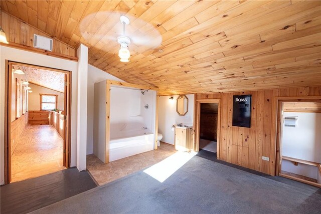 15035W Goss Rd, Hayward, WI 54843 - bathroom with wooden walls, lofted ceiling, a tub to relax in, wood ceiling, and toilet