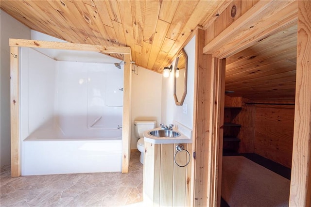 15035W Goss Rd, Hayward, WI 54843 - full bathroom with lofted ceiling, toilet, wood ceiling,  shower combination, and vanity
