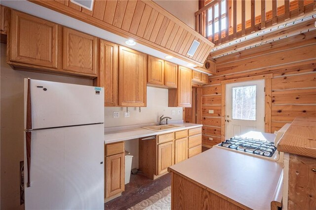 15035W Goss Rd, Hayward, WI 54843 - kitchen with white refrigerator, sink, and a skylight