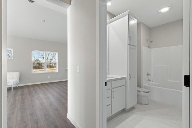 full bathroom featuring shower / bathtub combination, vanity, and toilet