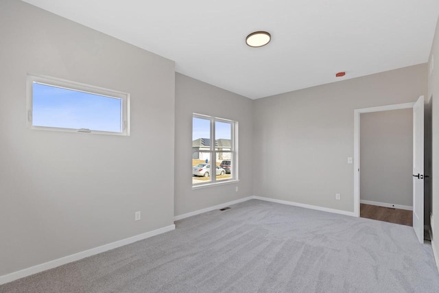 empty room with light colored carpet