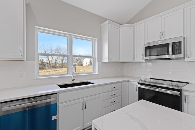 kitchen featuring white cabinetry, sink, and appliances with stainless steel finishes