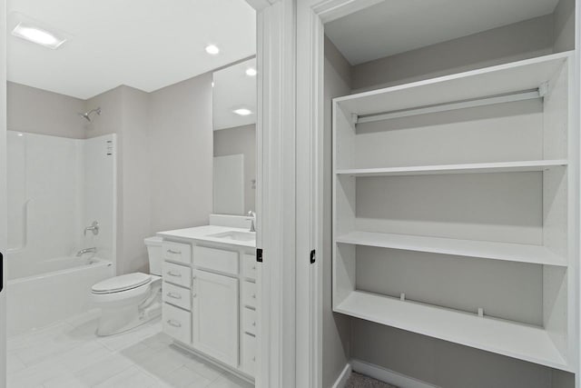 full bathroom with toilet, vanity, and  shower combination