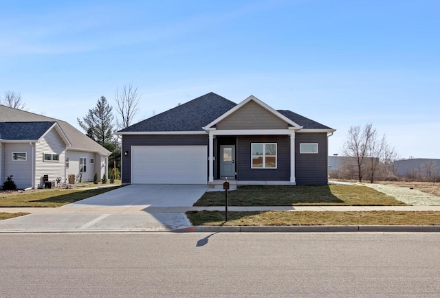 view of front of home with a garage and a front yard