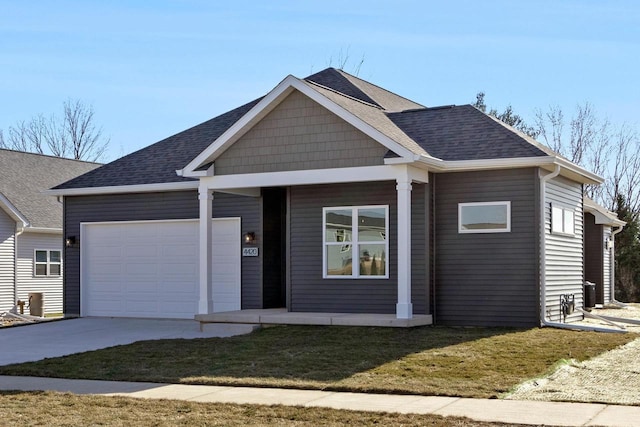 view of front facade with a garage and a front lawn