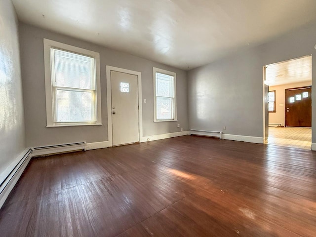 foyer featuring hardwood / wood-style flooring and a baseboard radiator