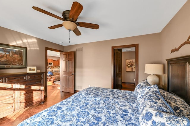 bedroom featuring hardwood / wood-style floors and ceiling fan
