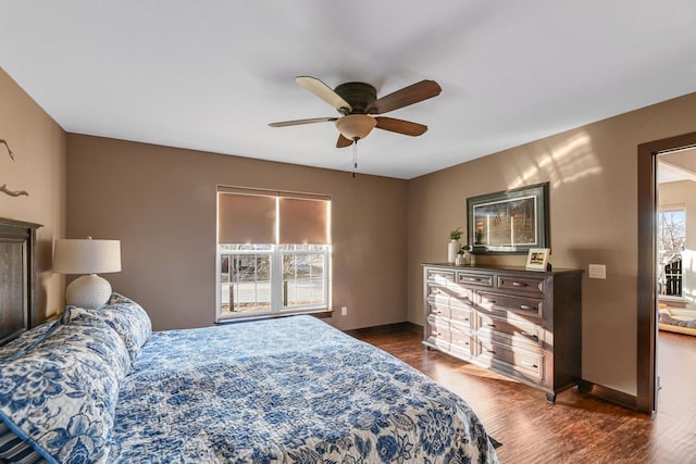 bedroom featuring ceiling fan and dark hardwood / wood-style flooring