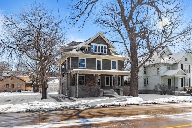 view of front of home with an outdoor structure and covered porch