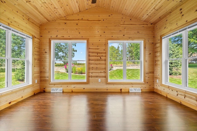 unfurnished sunroom featuring wood ceiling, vaulted ceiling, and a healthy amount of sunlight