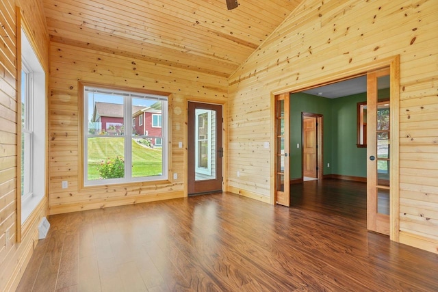 unfurnished room with wood ceiling, lofted ceiling, hardwood / wood-style floors, and wood walls