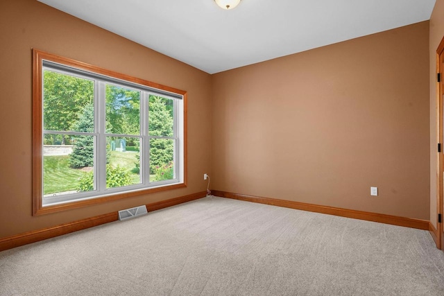 unfurnished room featuring carpet flooring