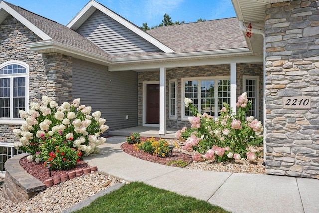 entrance to property featuring covered porch