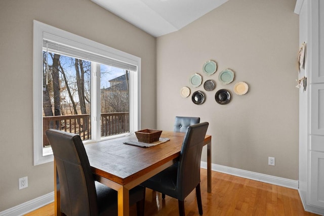 dining area featuring light wood-type flooring