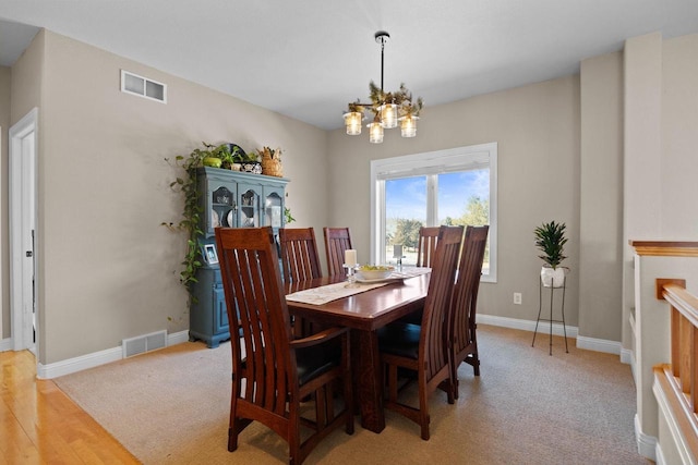 dining space featuring a chandelier