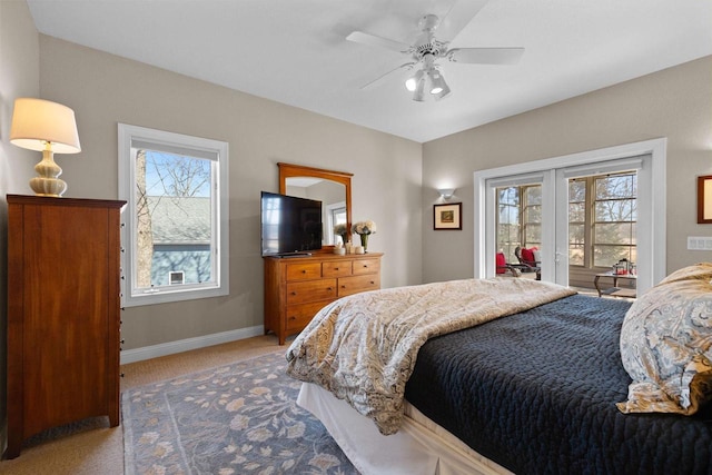 carpeted bedroom featuring access to exterior and ceiling fan