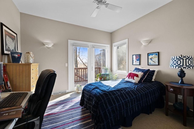 carpeted bedroom featuring access to exterior and ceiling fan