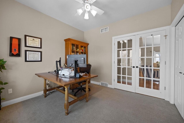 carpeted home office with french doors and ceiling fan