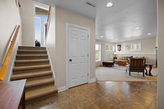 foyer entrance with tile patterned floors