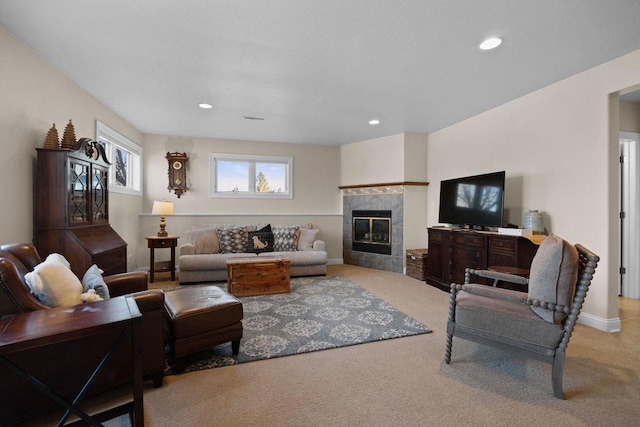 carpeted living room with a fireplace