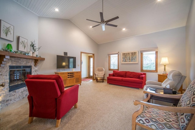 carpeted living room with a fireplace, high vaulted ceiling, and ceiling fan