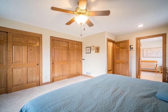 carpeted bedroom with ceiling fan