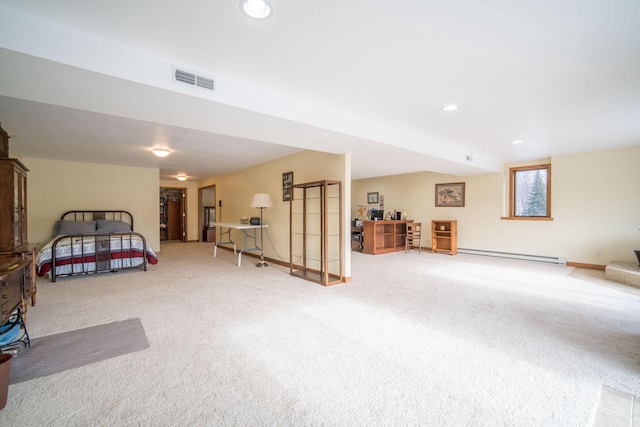 bedroom featuring a baseboard radiator and carpet